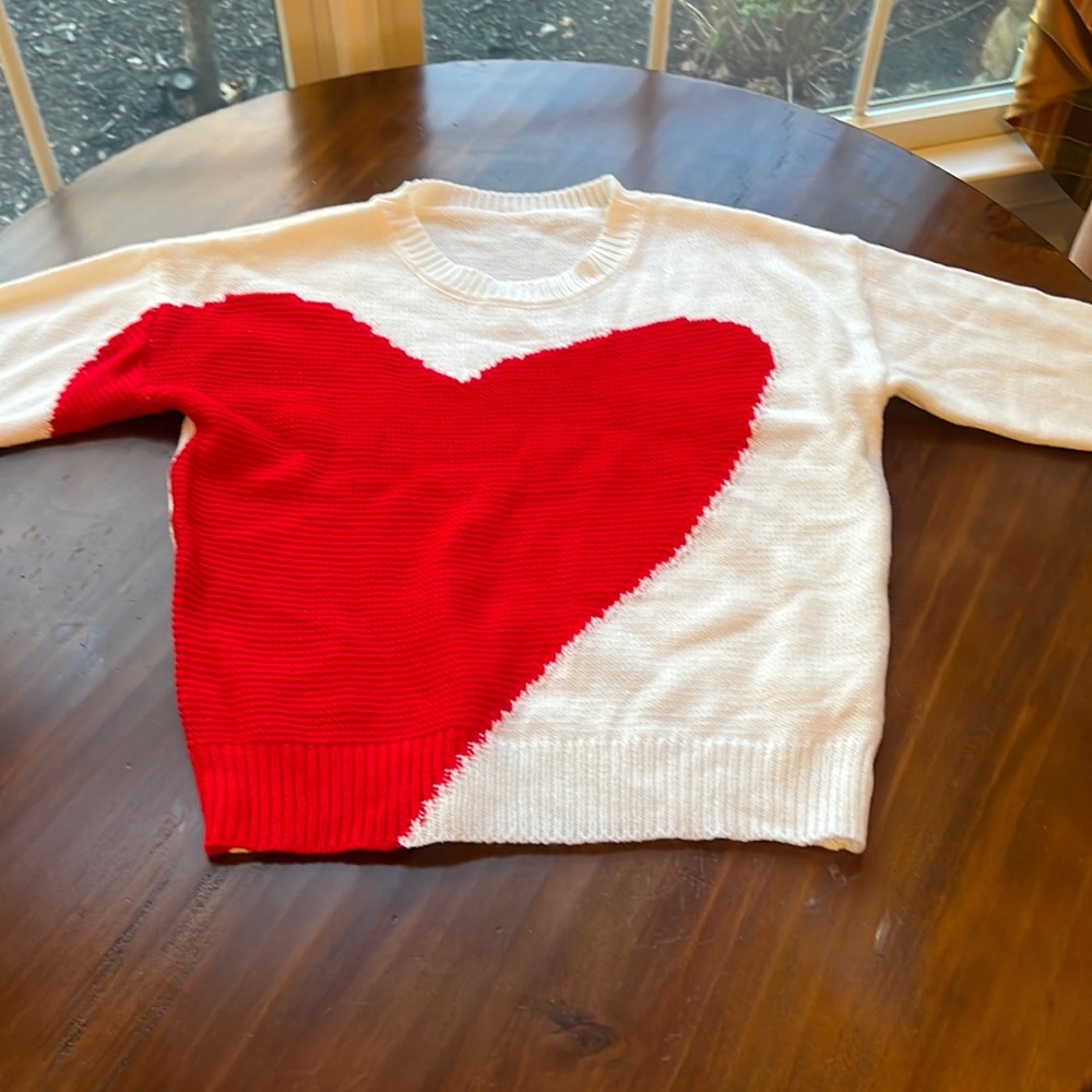 Heart sweater bought at local boutique.  Never worn.